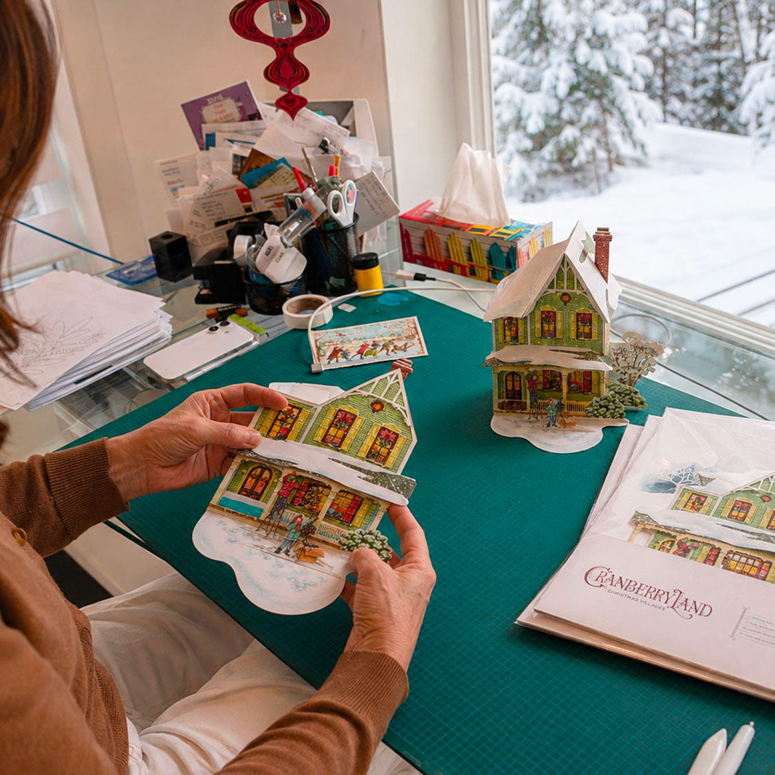 CranberryLand Christmas village houses folded flat for compact and easy storage after the holidays.